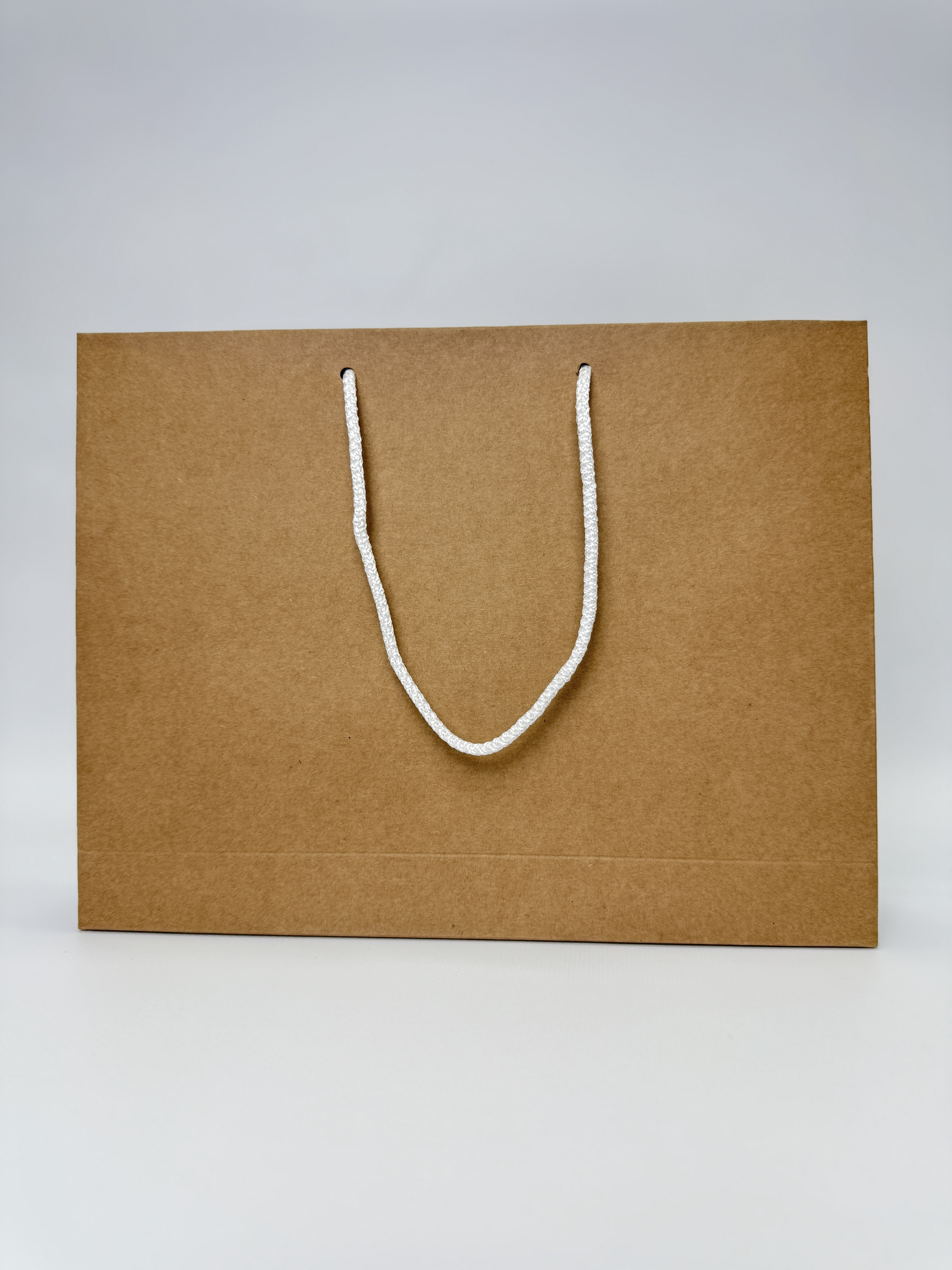 Пакет подарунковий крафт горизонтальний 30х23х6 см бурий